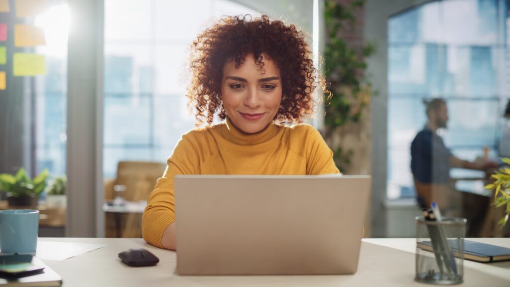 hr professional on computer smiling