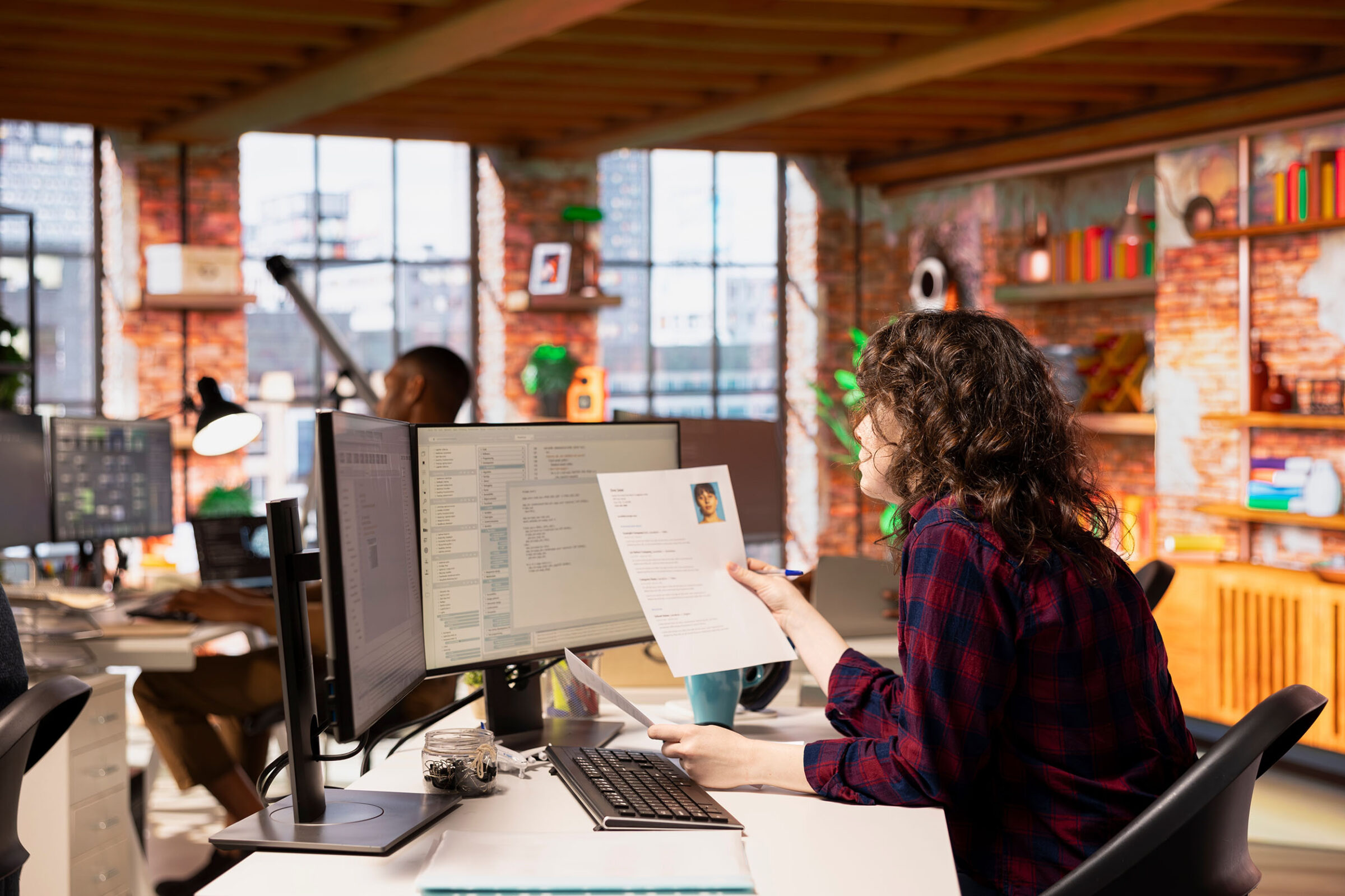 manager reviewing employee resume